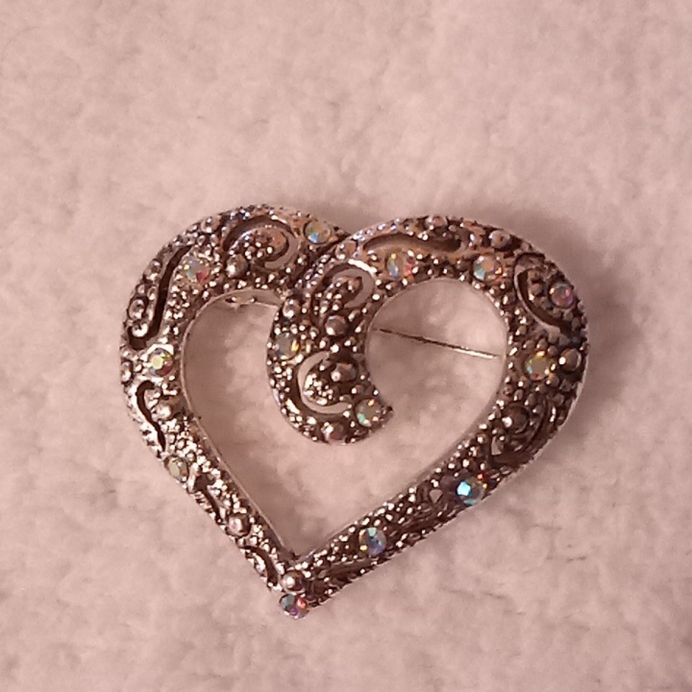 Beautiful AAi heart Brooch with  small gems that sparkle in the light.